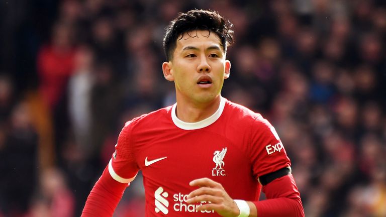 Liverpool's Wataru Endo during the English Premier League soccer match between Liverpool and Brighton & Hove Albion at Anfield, in Liverpool, England, Sunday March 31, 2024. (AP Photo/Rui Vieira)