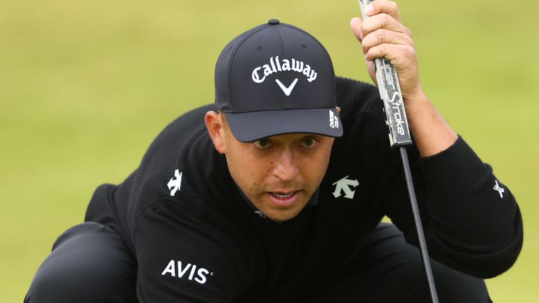 Xander Schauffele of the United States line sup a putt on the ninth green during his opening round of the British Open Golf Championships at Royal Troon golf club in Troon, Scotland, Thursday, July 18, 2024. (AP Photo/Peter Morrison)