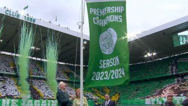 Lisbon Lion Jim Craig unfurls the league flag at Celtic Park!