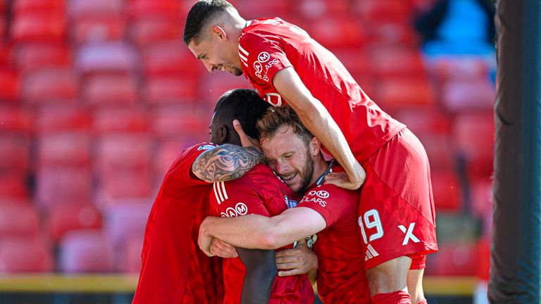 Pape Habib Gueye celebrates scoring with teammates 