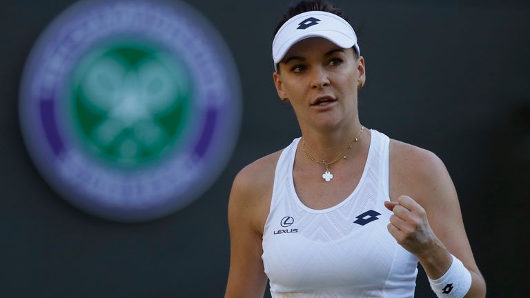 Agnieszka Radwanska of Poland celebrates winning a game from Elena-Gabriela Ruse of Romania during the Women's Singles first round match at the Wimbledon Tennis Championships in London, Monday July 2, 2018. (AP Photo/Kirsty Wigglesworth)