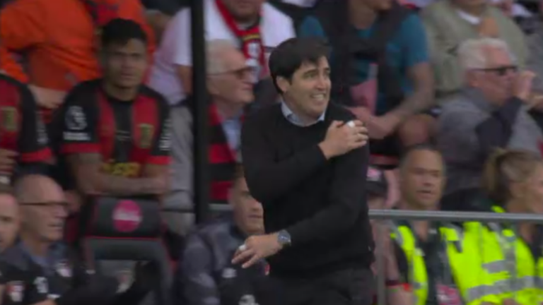 Andoni Iraola signals to referee David Coote where the ball struck Dango Ouattara