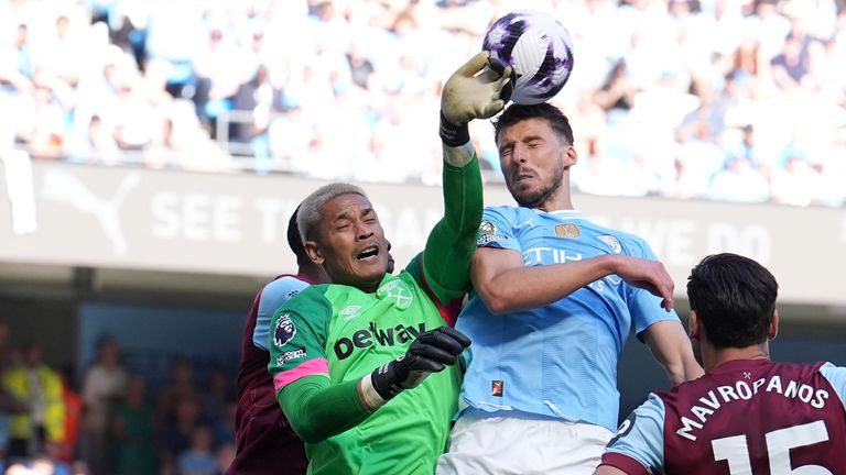 West Ham's Alphonse Areola competes with Man City's Ruben Dias last season