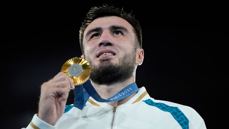 Gold medalist Uzbekistan's Bakhodir Jalolov poses during a medals ceremony for the men's +92 kg final boxing match at the 2024 Summer Olympics, Saturday, Aug. 10, 2024, in Paris, France. (AP Photo/John Locher)