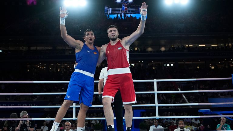 Uzbekistan's Bakhodir Jalolov celebrates after defeating Spain's Ayoub Ghadfa in their men's +92 kg final boxing match at the 2024 Summer Olympics, Saturday, Aug. 10, 2024, in Paris, France. (AP Photo/John Locher)