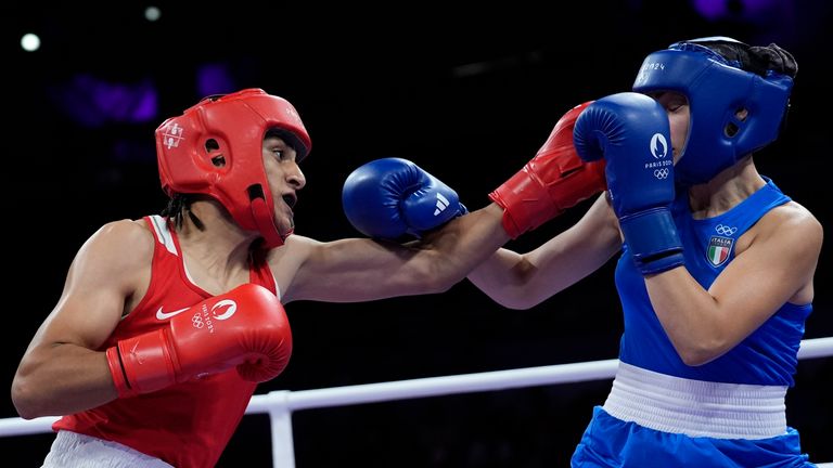 Algeria's Imane Khelif, left, fights Italy's Angela Carini in their women's 66kg preliminary boxing match at the 2024 Summer Olympics, Thursday, Aug. 1, 2024, in Paris, France. (AP Photo/John Locher)