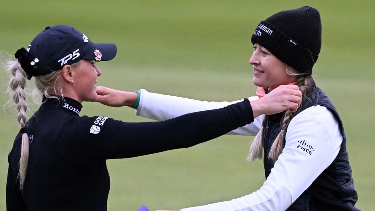 England's Charley Hull (L) and US' Nelly Korda hug each other at the end of the opening day of the 2024 Women's British Open Golf Championship, on the Old Course at St Andrews, in St Andrews, Scotland, on August 22, 2024. (Photo by ANDY BUCHANAN / AFP) / RESTRICTED TO EDITORIAL USE 