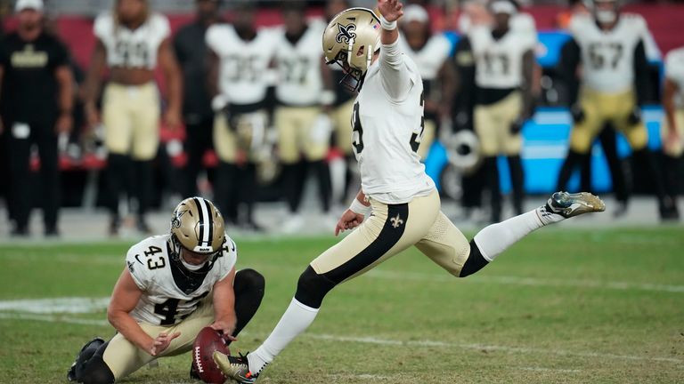 New Orleans Saints place kicker Charlie Smyth kicks the game winning field goal as Matthew Hayball (43) holds, in the second half of a preseason NFL football game against the Arizona Cardinals, Saturday, Aug. 10, 2024, in Glendale, Ariz. The Saints won 16-14. (AP Photo/Ross D. Franklin) 