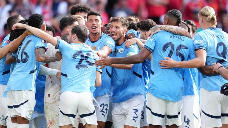 Sport News Manchester City players celebrate their penalty shootout victory over Manchester United in the Community Shield