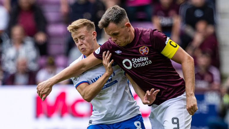 Rangers' Connor Barron and Hearts' Lawrence Shankland in action