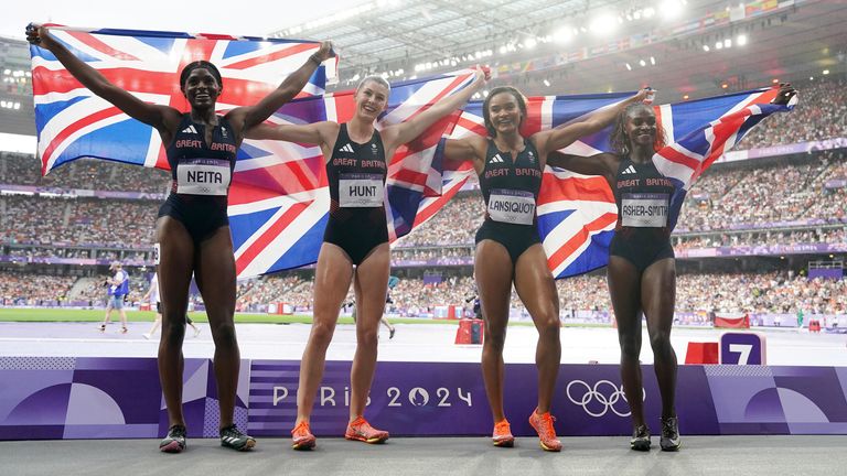 Great Britain's Daryll Neita, Amy Hunt, Imani Lansiquot and Dina Asher-Smith celebrate winning silver in the Women's 4 x 100m Relay Final at the Stade de France on the fourteenth day of the 2024 Paris Olympic Games in France. Picture date: Friday August 9, 2024.