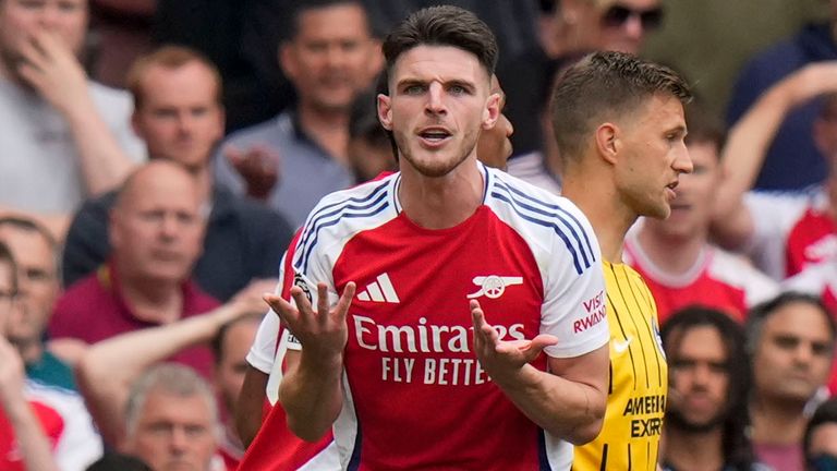 Arsenal's Declan Rice leaves the pitch after being shown a red card (AP Photo/Alastair Grant)