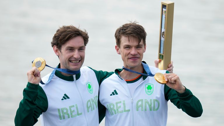 Ireland's Fintan McCarthy and Paul O'Donovan pose with the gold medal after winning the men's lightweight double sculls