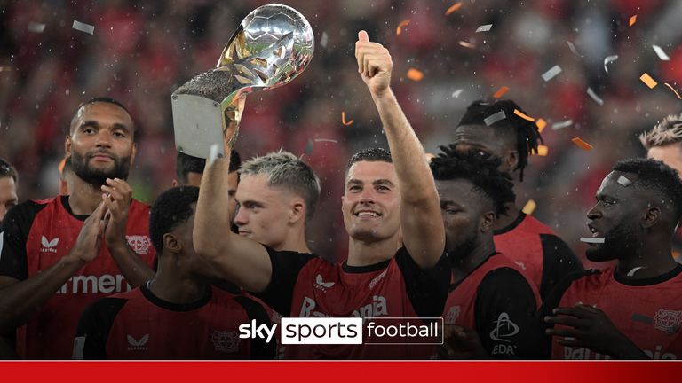 17 August 2024, North Rhine-Westphalia, Leverkusen: Soccer, DFL Supercup, Final, Bayer Leverkusen - VfB Stuttgart, BayArena: Leverkusen's Patrik Schick holds the trophy in the middle of the cheering team