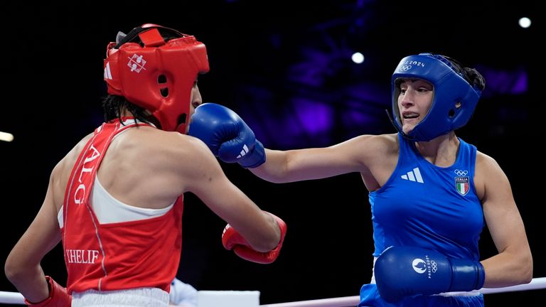 Algeria's Imane Khelif, left, fights Italy's Angela Carini in their women's 66kg preliminary boxing match at the 2024 Summer Olympics, Thursday, Aug. 1, 2024, in Paris, France. (AP Photo/John Locher)