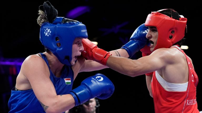 Algeria's Imane Khelif, right, fights Hungary's Anna Hamori in their women's 66kg quarterfinal boxing match at the 2024 Summer Olympics, Saturday, Aug. 3, 2024, in Paris, France. (AP Photo/John Locher)