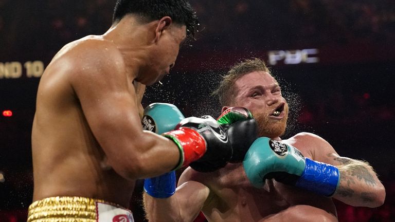 Jaime Munguia lands a left to Canelo Alvarez in a super middleweight title fight Saturday, May 4, 2024, in Las Vegas. (AP Photo/John Locher)