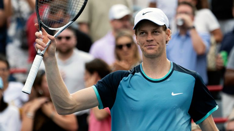 CORRECTS TO BORNA CORIC NOT BORJA CORIC - Italy's Jannik Sinner salutes the crowd after defeating Croatia's Borna Coric in straight sets during their second-round match at the National Bank Open tennis tournament Thursday, Aug. 8, 2024, in Montreal. (Ryan Remiorz/The Canadian Press via AP)