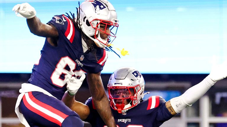 New England Patriots wide receiver JaQuae Jackson (left) celebrates his touchdown with Kawaan Baker (86) during the second half of an NFL preseason football game against the Carolina Panthers, Thursday, Aug. 8, 2024, in Foxborough, Massachusetts. (AP Photo/Mark Stockwell) 