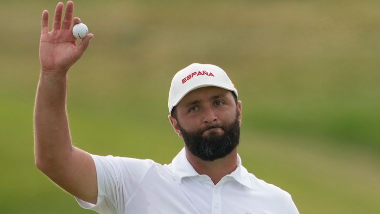 Jon Rahm, of Spain, acknowledges the crowd after completing his round on the 18th green during the third round of the men's golf event at the 2024 Summer Olympics, Saturday, Aug. 3, 2024, at Le Golf National in Saint-Quentin-en-Yvelines, France. (AP Photo/Matt York)