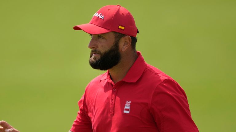 Jon Rahm, of Spain, acknowledges the crowd after making a birdie putt on the 10th green during the final round of the men's golf at the 2024 Summer Olympics, Sunday, Aug. 4, 2024, at Le Golf National in Saint-Quentin-en-Yvelines, France. (AP Photo/Matt York)