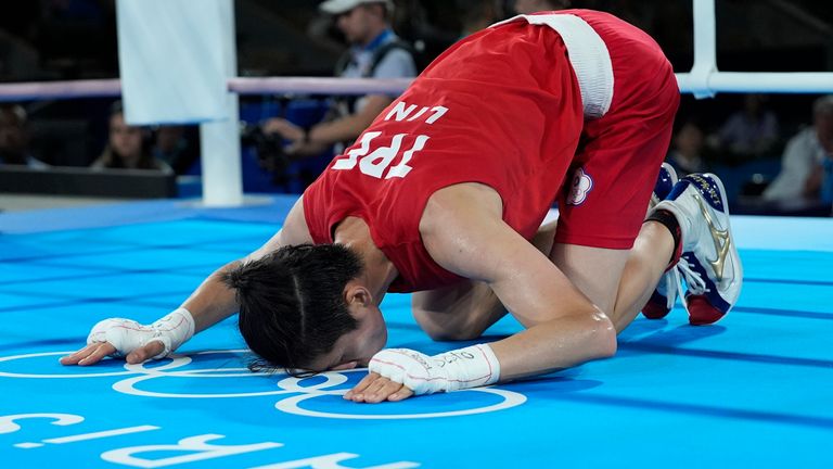 Taiwan's Lin Yu-ting celebrates after defeating Poland's Julia Szeremeta in their women's 57 kg final boxing match at the 2024 Summer Olympics, Saturday, Aug. 10, 2024, in Paris, France. (AP Photo/John Locher)