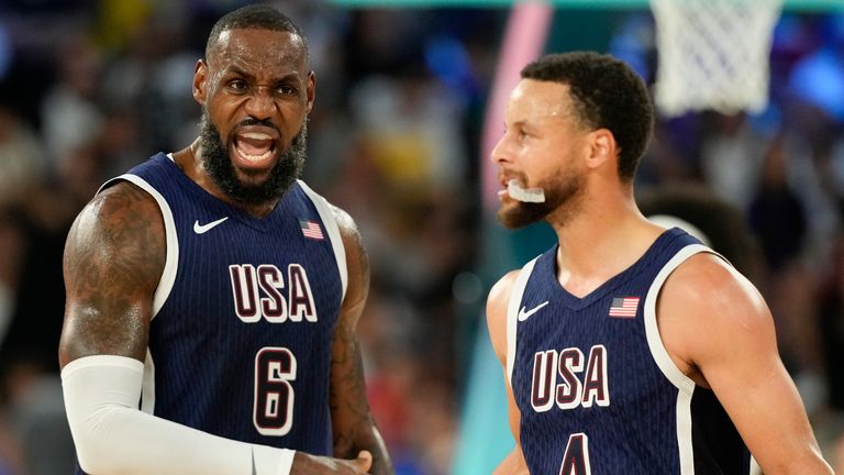 United States' LeBron James (6) and United States' Stephen Curry (4) celebrates after scoring a basket against France during a men's gold medal basketball game at Bercy Arena at the 2024 Summer Olympics, Saturday, Aug. 10, 2024, in Paris, France. (AP Photo/Mark J. Terrill)