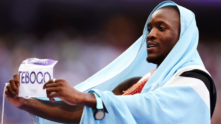 Letsile Tebogo of Botswana celebrates winning gold in the men's 200m at the Paris 2024 Olympic Games (Associated Press)