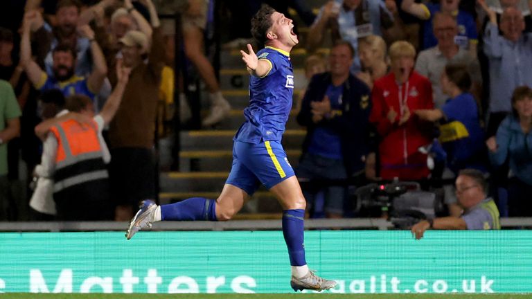 Mathew Stevens celebrates scoring AFC Wimbledon's second goal.