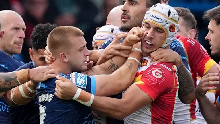 Catalans Dragons v Hull KR - Betfred Super League Magic Weekend - Elland Road
Hull KR's Mikey Lewis (centre left) and Catalans Dragons' Cesar Rouge (centre right) clash during the Betfred Super League match at Elland Road, Leeds. Picture date: Sunday August 18, 2024.