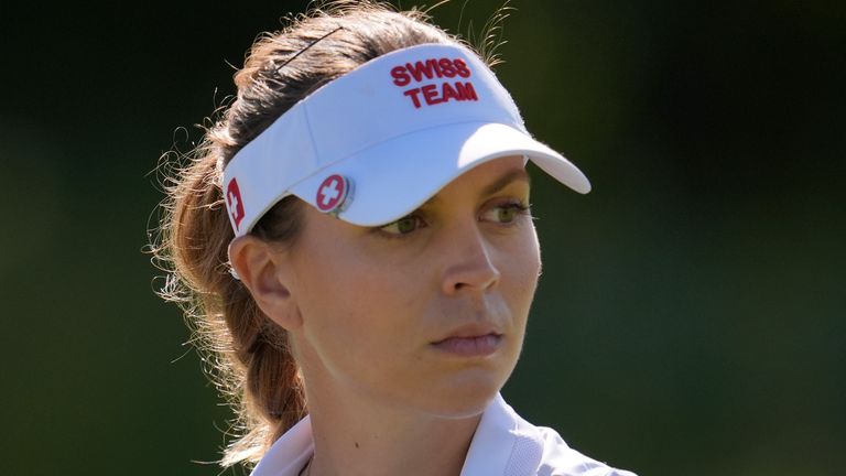 Morgane Metraux, of Switzerland, walks off the 6th tee as she talks to her caddie during the second round of the women's golf event at the 2024 Summer Olympics, Thursday, Aug. 8, 2024, at Le Golf National, in Saint-Quentin-en-Yvelines, France. (AP Photo/George Walker IV) 