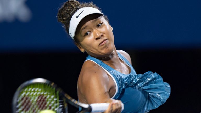 TORONTO, ON - AUGUST 08: Naomi Osaka of Japan hits a shot during her second round match of the National Bank Open, part of the WTA Tour, at Sobeys Stadium on August 8, 2024 in Toronto, Canada. (Photo by Julian Avram/Icon Sportswire) (Icon Sportswire via AP Images)