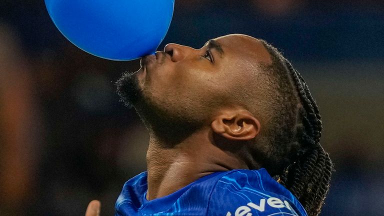 Chelsea's Christopher Nkunku celebrates after scoring his side's opening goal from a penalty spot during the Europa Conference League play-off first leg soccer match between Chelsea and Servette, at Stamford Bridge stadium in London, Thursday, Aug. 22, 2024. (AP Photo/Alastair Grant)