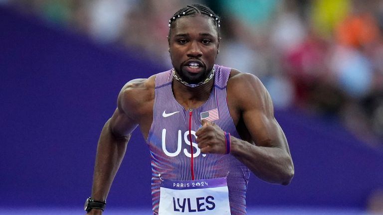 Noah Lyles, of the United States, competes during a heat in the men's 100m semi-finals at the 2024 Summer Olympics, Sunday, Aug. 4, 2024, in Saint-Denis, France. (AP Photo/Petr David Josek)