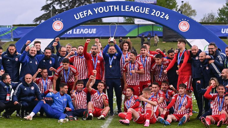 Sotiris Silaidopouplos lifts the UEFA Youth League trophy