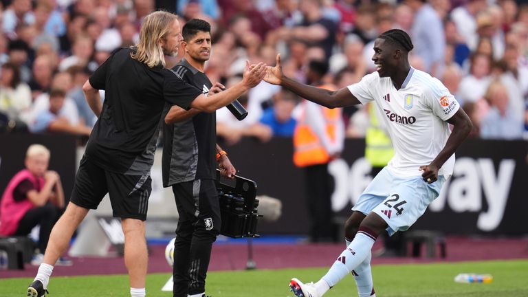 Amadou Onana celebrates with Aston Villa set-piece coach Austin MacPhee