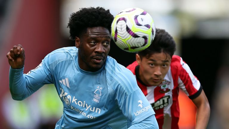 Ola Aina and  Yukinari Sugawara battle for the ball