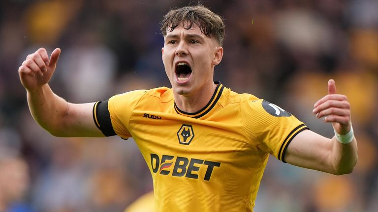 Goalscorer Jorgen Strand Larsen encourages the home fans at Molineux