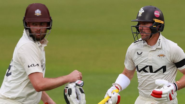 Rory Burns and Dom Sibley of Surrey run between the wickets during day one of the Vitality County Championship match between Surrey and Lancashire at The Kia Oval 