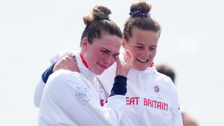 Great Britain's Lauren Irwin (L) and Emily Ford (R) walk out to collect their bronze medals won in the Women's Eight Final at the Vaires-sur-Marne Nautical Stadium 