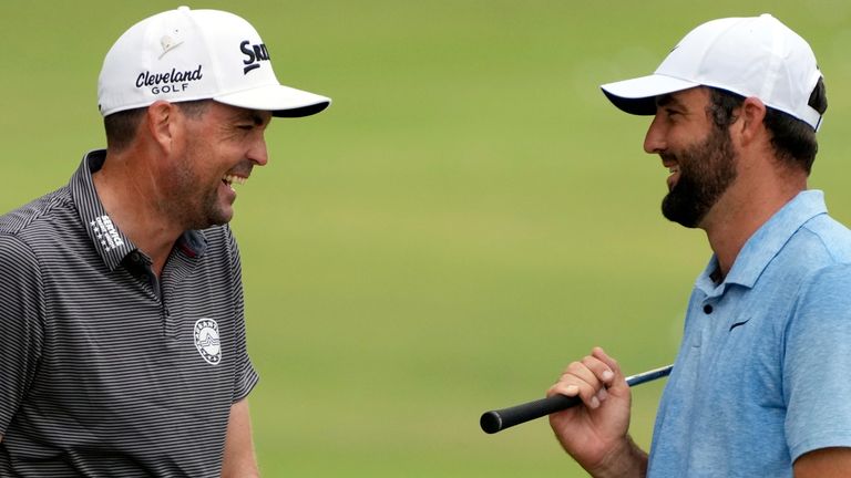 Keegan Bradley, left, talks with Scottie Scheffler at the St. Jude Championship golf tournament Wednesday, Aug. 14, 2024, in Memphis, Tenn. The tournament is scheduled to begin Thursday. (AP Photo/Mark Humphrey)