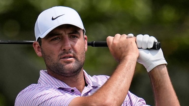 Scottie Scheffler hits from the third tee during the first round of the Tour Championship golf tournament, Thursday, Aug. 29, 2024, in Atlanta. (AP Photo/Mike Stewart) 