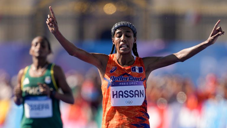 Sifan Hassan, of the Netherlands, celebrates after crossing the finish line to win the gold medal at the end of the women's marathon competition at the 2024 Summer Olympics, Sunday, Aug. 11, 2024, in Paris, France. (AP Photo/Vadim Ghirda) 