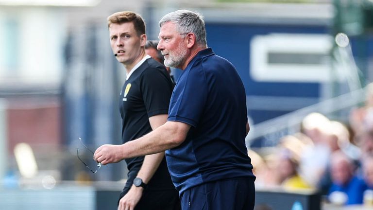 St Johnstone manager Craig Levein watches on