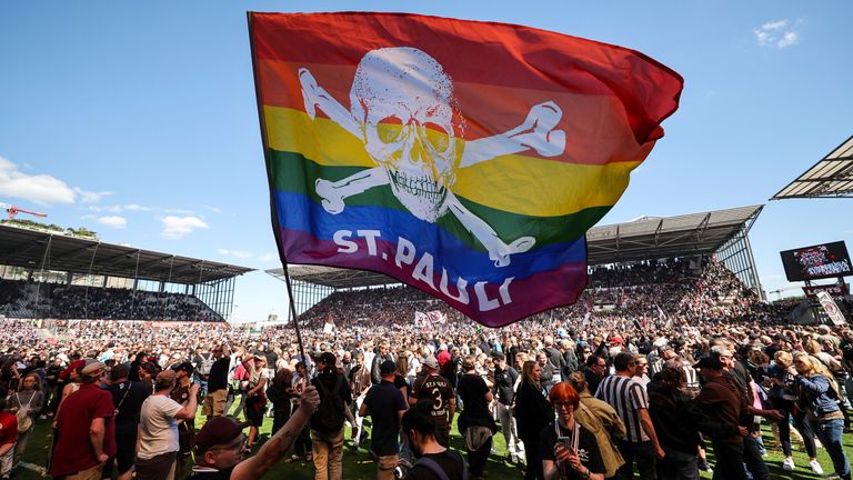 12 May 2024, Hamburg: Soccer: Bundesliga 2, FC St. Pauli - VfL Osnabr'ck, matchday 33 at the Millerntor Stadium, St. Pauli fans celebrate promotion after the match. FC St. Pauli is promoted to the Bundesliga ahead of schedule.