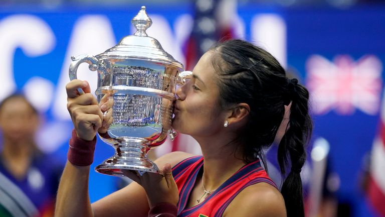 Emma Raducanu, of Britain, kisses the US Open championship trophy after defeating Leylah Fernandez, of Canada, during the women&#39;s singles final of the US Open tennis championships, Saturday, Sept. 11, 2021, in New York. (AP Photo/Seth Wenig)


