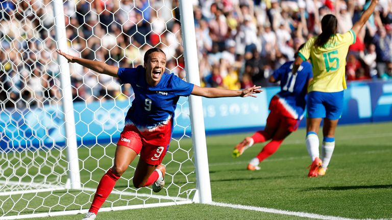 Mallory Swanson of the United States celebrates scoring the opening goal