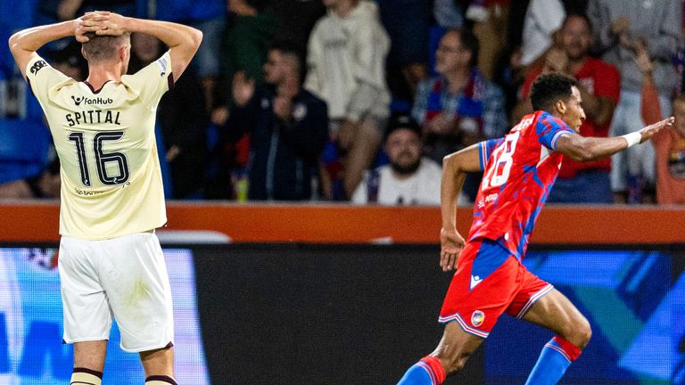 PLZEN, CZECH REPUBLIC - AUGUST 22: Viktoria Plzen's Jhon Mosquera celebrates as Hearts Blair Spittal looks on during a UEFA Europa League play-off match between FC Viktoria Plzen and Heart of Midlothian at the Doosan Arena, on August 22, 2024, in Plzen, Czech Republic.  (Photo by Mark Scates / SNS Group)