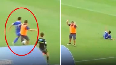 Outrageous moment coach hacks player down to stop counter-attack... and sees red!