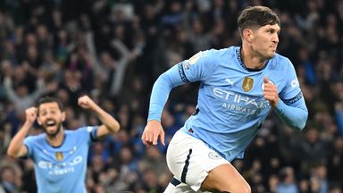 John Stones wheels away to celebrate after scoring a last-gasp equaliser against Arsenal